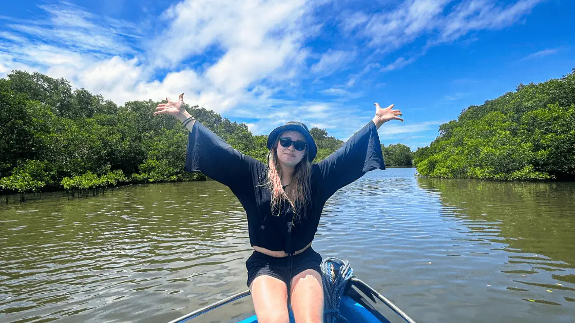 A woman doing slow travel on a mangrove cruise