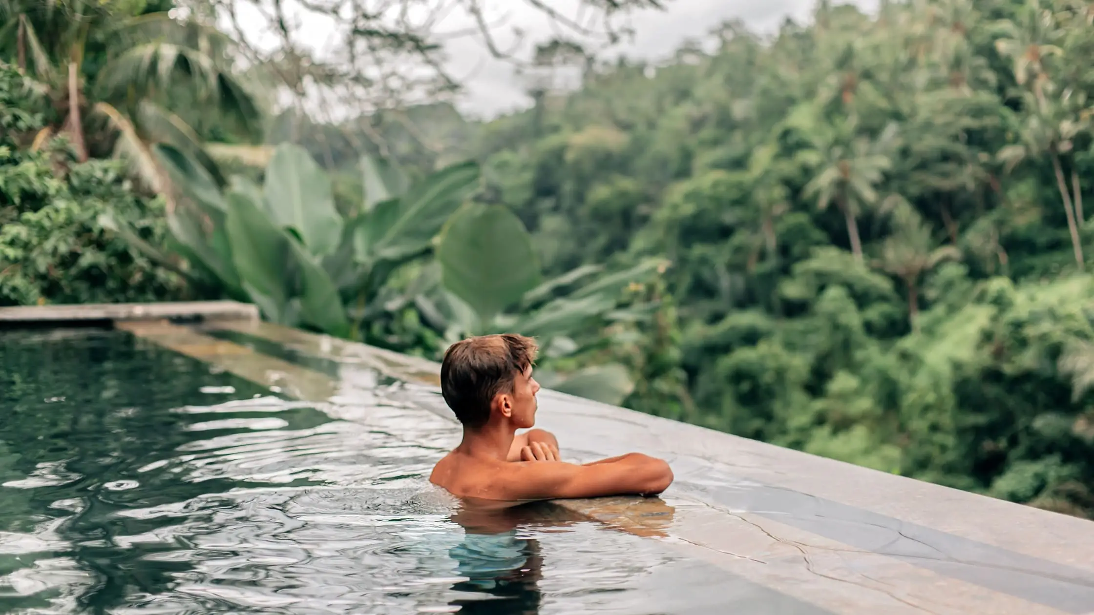 Human Swimming in Bali Infinity Pool