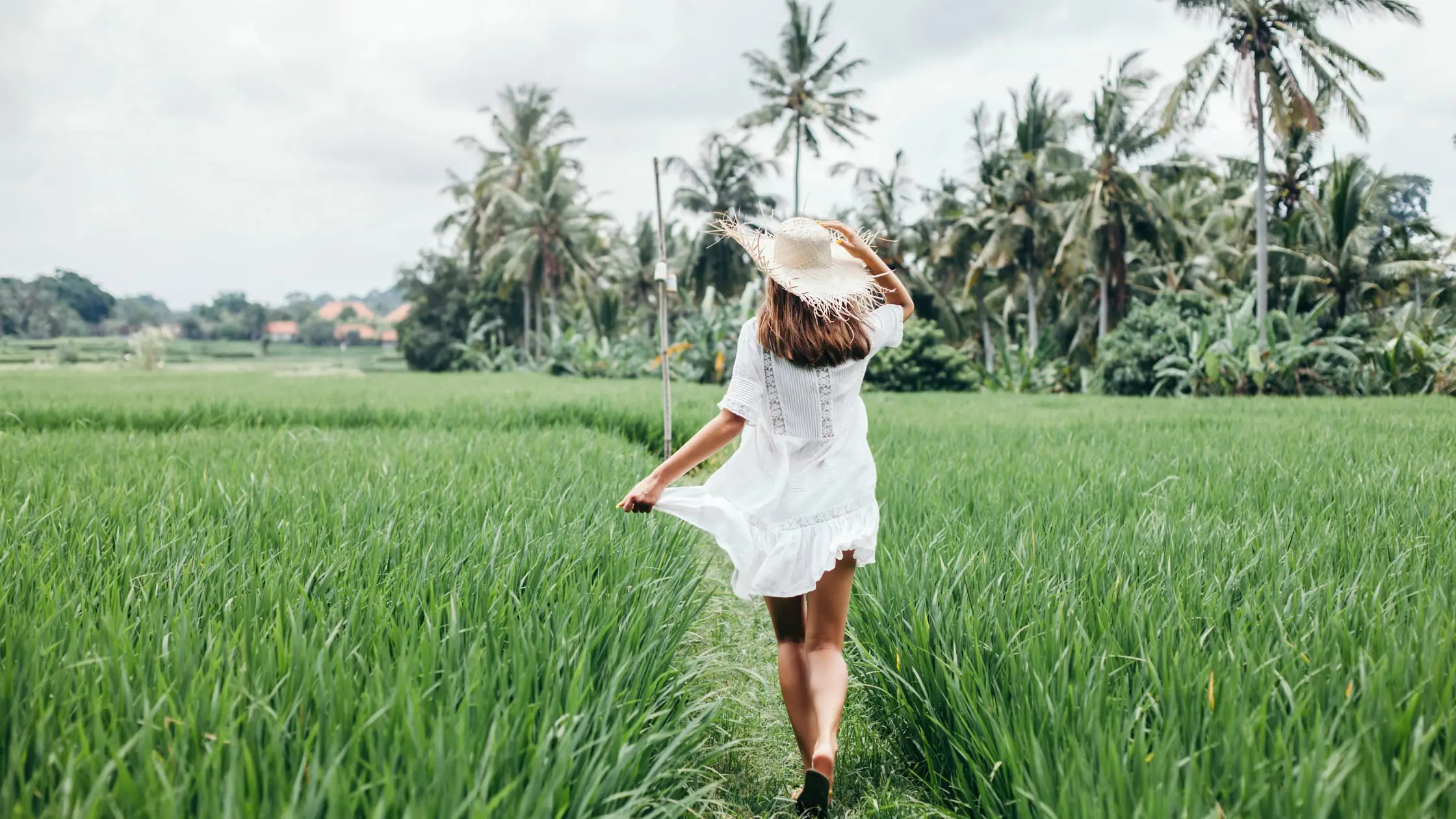Young Girl Walking in Rice Field in Bali