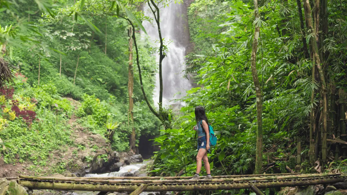 Tourist Woman Trekking in Bali Jungle